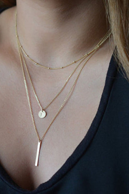 Personalized multi-layered necklace with small vertical pendant clavicle